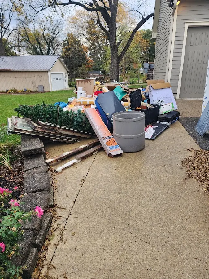 Dumpster being loaded with debris for Demolition Dumpster Rental in West Providence